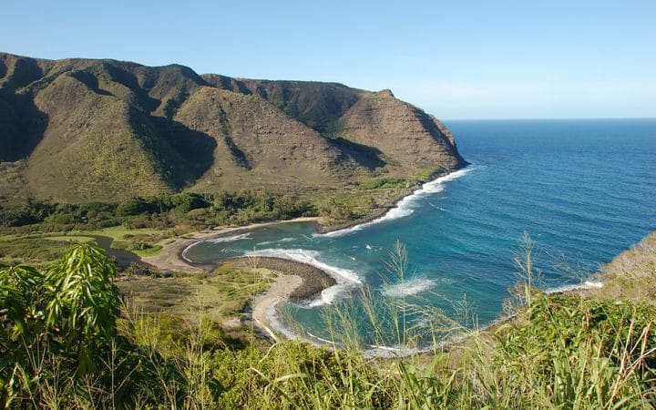 Hālawa Valley on Molokaʻi: a green valley opening onto a curving bay