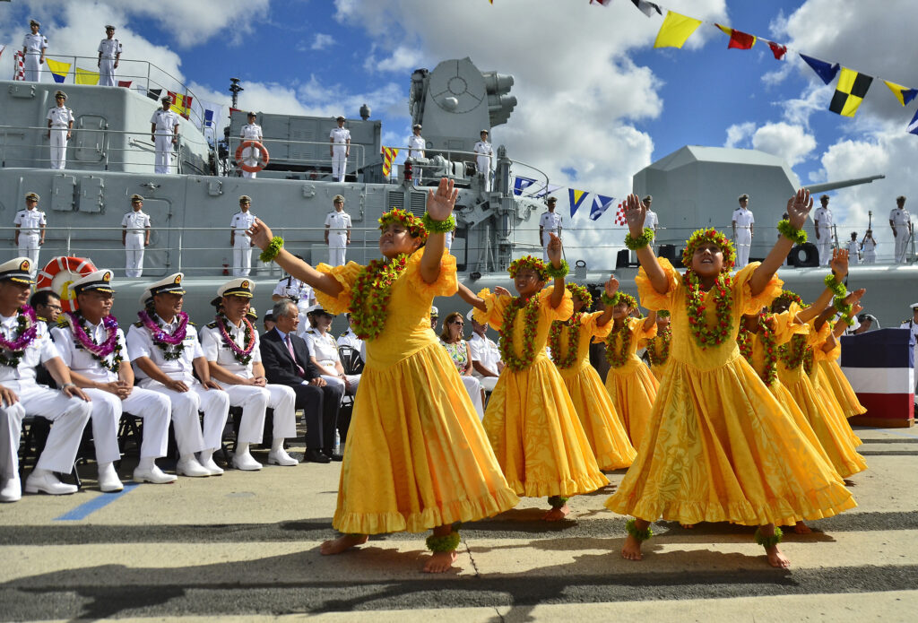 Traditional Hawaiian hula dancers performing at a cultural ceremony in Hawaiʻi
